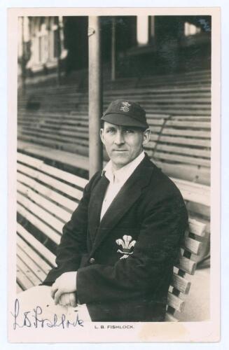 Laurence Barnard &lsquo;Laurie&rsquo; Fishlock. Surrey & England 1931-1952. Original mono real photograph postcard of Fishlock seated half length in front of the pavilion at The Oval, wearing Surrey cap and blazer. Signed in blue ink to the lower left corner by Fishl