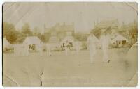 Sussex v Lancashire, Hove 1912. Sepia real photograph postcard of Captain Ranjitsinhji leading out the players to field at the match played at Hove in July 1912. The title to lower border reads ‘Sussex v Lancashire, Hove 1912. H.H. the Jam Sahib leads his