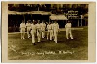 ‘Sussex XI taking the field at Hastings’ 1920. Sepia real photograph postcard for the match Sussex v Northamptonshire, Hastings, 14th-17th August 1920. The postcard depicts the Sussex players being led on to the field after the lunch break on the first da