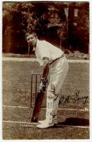 Richard Alfred Young. Cambridge University, Sussex & England 1905-1925. Excellent sepia real photograph postcard of Young in batting pose at the wicket. Nicely signed by Young in black ink to image. Foster of Brighton. Postally used. Good condition