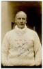 Arthur Edward Robert Gilligan. Cambridge University, Surrey, Sussex & England 1919-1932. Sepia real photograph postcard of Gilligan, standing half length, wearing Sussex sweater. Signed in ink to the image by Gilligan. Postcard by Deane, Wiles & Millar of