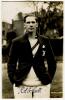 Robert Strickland Gilbert Scott. Sussex 1931-34. Mono real photograph postcard of Scott, half length,wearing Oxford University sweater and blazer. Nicely signed in black ink by Scott to lower border. Deane, Wiles & Millar of Brighton. Minor adhesive marks