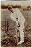 Frank Stanley Jackson. Yorkshire, Cambridge University & England 1890-1907. Sepia real photograph postcard of Jackson, full length, in batting pose in front of the wicket wearing Yorkshire cap. Hawkins of Brighton postcard. Adhesive mark to verso otherwis