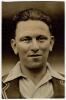 Maurice Leyland. Yorkshire & England 1920-1947. Mono real photograph candid postcard of Leyland standing at the back of the players area at I believe Scarborough, smoking a cigarette. Signed by Leyland in black ink. Some wear to card, some creases and los - 3