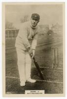 John Richmond Gunn. Nottinghamshire & England 1896-1925. Phillips ‘Pinnace’ premium issue cabinet size mono real photograph trade card of Gunn, standing full length at the wicket in batting pose, wearing Nottinghamshire cap. No. 64.C. 4”x6”. Plain back. V