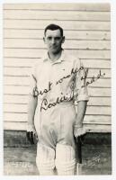 Leslie John Todd. Kent 1927-1950. Mono real photograph postcard of Todd, three quarter length, wearing cricket attire and leaning on his bat. Nicely signed in ink by Todd. B.C. Flemons of Tonbridge. Postally unused. Very good condition