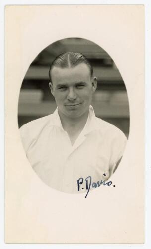 Charles Percival &lsquo;Percy&rsquo; Davis. Northamptonshire 1935-1952. Mono real photograph postcard of Davis, head and shoulders in cameo, wearing cricket attire. Nicely signed in ink by Davis to the photograph. Official stamp to verso for A. Wilkes & Son, West Bro