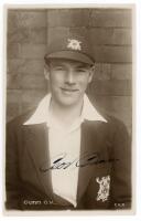 George Vernon Gunn. Nottinghamshire 1928-1950. Sepia real photograph postcard of Gunn, half quarter length wearing Nottinghamshire cap and blazer at Trent Bridge, probably c.1930. C.H. Richards, Nottingham. Very nicely signed in ink to the photograph by G