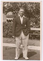 Maurice Leyland. Yorkshire & England 1920-1946. Original sepia real photograph postcard of Leyland standing full length wearing cricket attire and Yorkshire blazer. Nicely signed in black ink to the photograph by Leyland. Photographer and location unknown