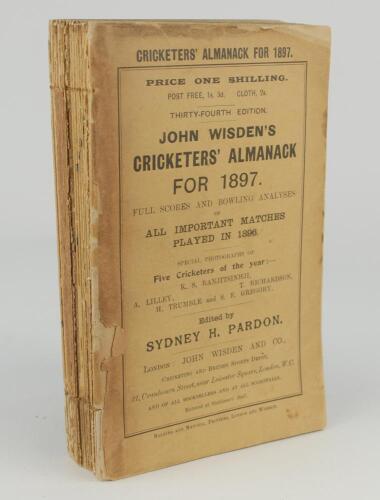 Wisden Cricketers’ Almanack 1897. 34th edition. Original paper wrappers. Breaking to spine block, some page sections becoming loose, complete loss of spine paper, front wrapper with loss to edge and almost detached, some loss to rear wrapper extremities o