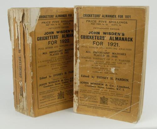 Wisden Cricketers&rsquo; Almanack 1921 and 1922. 58th & 59th editions. Original paper wrappers. Both editions with some breaking to spine blocks, page sections becoming slightly loose, both editions with some wear to wrappers and spine papers with loss to both,