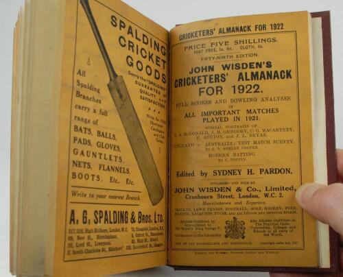 Wisden Cricketers&rsquo; Almanack 1922. 59th edition. Bound in maroon boards, with original wrappers, with gilt titles to spine, red speckled page edges. Unusually the front wrapper and front advertising pages have been bound into the rear of the book after the