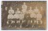 Exeter City F.C. 1909/10. Early original mono real photograph postcard of the Exeter City team seated and standing in rows wearing football attire. &lsquo;X&rsquo; annotated in ink to one player mentioned in correspondence to verso. Postmarked 1910. Photographer unkn