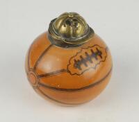 Football inkwell. A Victorian glazed transfer-printed stoneware inkwell, shaped as a slightly deflated football, with plated metal mount and hinged cover formed as a sporting cap, Reg no. 167873 (for 1891) to the underside. Approx 2.75” tall. Minor wear, 