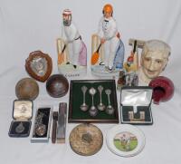 Cricket ceramics and metalware. A selection including &lsquo;Cricketers&rsquo; Tape&rsquo;, original measuring tape with brass fittings, two silver cricket medals, one hallmarked, three silver cricket spoons, Sandland ceramic red cricket ball shaped ashtray with printed si