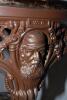 W.G. Grace. Original cast iron circular public house table with circular wooden top, supported by three legs, moulded with portrait busts of Grace wearing cricket cap to top of each leg with imprinted initials &lsquo;W.G&rsquo; above, and decorated pierced apron of b - 2