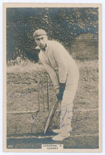 Andrew ‘Andy’ Sandham. Surrey & England 1911-1937. Phillips ‘Pinnace’ premium issue cabinet size sepia real photograph trade card of Sandham, full length in batting pose wearing Surrey cap. Signed in blue ink to the photograph by Sandham with dedication t