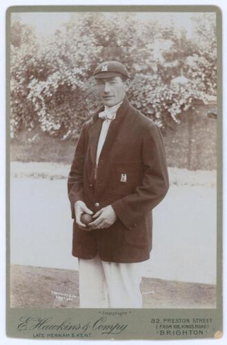 Percy Jeeves. Warwickshire 1912-1914. Original sepia cabinet card photograph of Jeeves standing three quarter length holding a ball, wearing Warwickshire cap and blazer. E. Hawkins & Co. of Brighton. Card measures 4.25”x6.5”. Minor wear to one corner and 