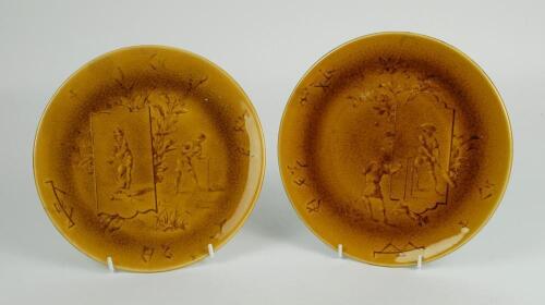 Cricket plate circa 1910. A rare pair of Choisy Le-Roi Majolica mustard coloured cricket plates, green to verso, depicting an Asian cricket match in the French Empire (Vietnam) with images of children (oriental) playing cricket to centre with foliage deco