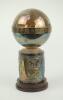 ‘England tour of Sri Lanka 1982’. Decorative silver metal commemorative chalice. The lid in the shape ball with title to rim, decorative base with panels of ornate birds/ducks? to sides of base. The chalice stands on a small wooden base. Approximately 9” 