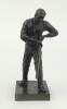 Charles Burgess Fry. Early 20th century spelter figure of C.B. Fry wearing cricket cap portrayed in batting pose playing a shot. This was one item of a three piece garniture, all featuring Fry as a batsman and bowler, with the centrepiece of him as a wick