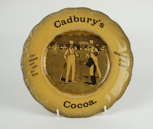 Cricket plate. ‘Cadbury’s Cocoa. The Oldest and still the best. Absolutely Pure Cocoa’. An advertising plate for Cadbury’s printed to centre with a cricket scene of a boy serving a cup of cocoa to a batsman during a game, wicket keep and fielders plus cro