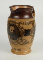 W.G. Grace. Impressive Doulton Lambeth stoneware jug with pale body and dark brown rim, decorated with three portraits/roundels of W.G. Grace, K.S. Ranjitsinhji and George Giffen within scrolling foliage. Two tone brown strap handle. Produced in 1896. App