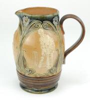 Doulton Lambeth stoneware jug, of ovoid form, moulded with relief vignettes of cricketers, a batsman, bowler and wicket keeper, Abel, Woods and McGregor in white on a brown background. With stylised daisy and floral leaf Art Nouveau decoration to top and