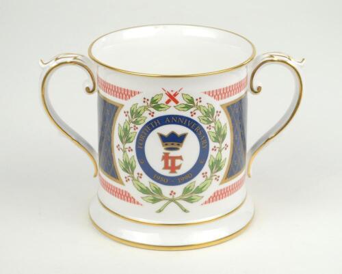 ‘Lord’s Taverners 40th Anniversary 1950-1990’. Spode china two handled loving tankard with decoration and titles to front and back, gold lustre to handles, rim, and base. 4.5” tall. Limited edition of 200 produced. G