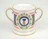 ‘Lord’s Taverners 40th Anniversary 1950-1990’. Spode china two handled loving tankard with decoration and titles to front and back, gold lustre to handles, rim, and base. 4.5” tall. Limited edition of 200 produced. G