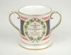 ‘Lord’s Taverners 40th Anniversary 1950-1990’. Spode china two handled loving tankard with decoration and titles to front and back, gold lustre to handles, rim, and base. 4.5” tall. Limited edition of 200 produced. G - 2