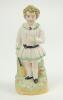 Staffordshire figure. Original Staffordshire 19th century pottery figure of a child holding a cricket bat to side, wearing a white smock coat and bloomers with stumps behind. Approximately 6” tall. Good condition