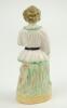 Staffordshire figure. Original Staffordshire 19th century pottery figure of a child holding a cricket bat to side, wearing a white smock coat and bloomers with stumps behind. Approximately 6” tall. Good condition - 2