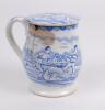 Staffordshire shaving mug. Victorian Staffordshire shaving mug and ceramic cover (lid) with strap handle, transfer printed in blue, with a cricket scene of batsman, wicket-keeper and two fielders with pavilion and trees to background. To verso, a football - 2