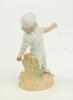 Child cricketer. Small continental figure of a child cricketer, wearing white cap, with ball in hand and in bowling pose standing on naturalistic base with wicket behind. Number 981 to back of figure on base. 5” tall. Not often seen. G - 2