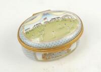 ‘Bicentenary of the M.C.C.’. Halcyon Days oval enamelled pill box. The lid with a cricket match at Lord’s, the hinged lid revealing title ‘To commemorate the Bicentenary of the Marylebone Cricket Club 1787-1987’ and small vignette of Thomas Lord. The oute