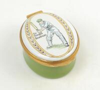 Sir Donald Bradman. Modern enamelled oval pillbox hand decorated with a portrait of Bradman standing full length in batting pose. Set of stumps decoration to inside lid. Produced by Crummles of Poole, Dorset. VG