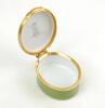 Sir Donald Bradman. Modern enamelled oval pillbox hand decorated with a portrait of Bradman standing full length in batting pose. Set of stumps decoration to inside lid. Produced by Crummles of Poole, Dorset. VG - 2