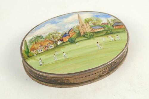 ‘Village Cricket’. Highly attractive silver hallmarked oval box with enamelled village cricket scene to lid, showing g a match in progress with houses, trees and a church to background. Hallmarked to base ‘Sterling 925’ with imported London hallmarks for 