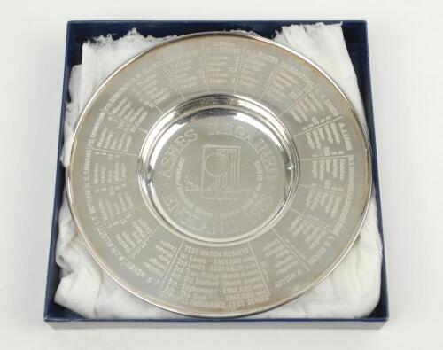 ‘Ashes Regained. England 1985’. Silver plate dish with title to centre, Test match results and players names and biographies to borders. 6” diameter. In original presentation box. VG