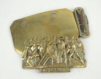 ‘The Eleven’. Exquisite and highly decorative Victorian brass decorative part of a belt buckle depicting the eleven players with title to lower border. Lacking the backing plate to which it was attached. 3.25”x2”. Sold with a brass backing plate with clip