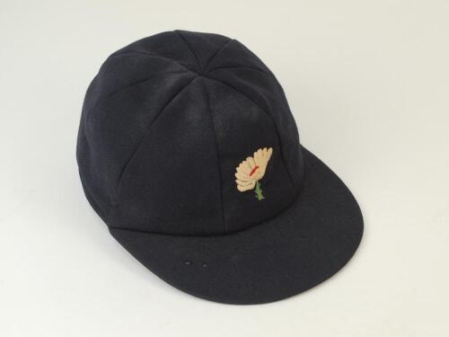 Charles William Jeffrey Athey. Yorkshire, Gloucestershire and Sussex 1976-1997. Yorkshire navy blue cloth 1st XI cricket cap worn by Athey whilst playing for Yorkshire, embroidered with the White Rose of Yorkshire to front. Some wear and several moth hole