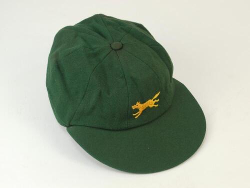 Roger Tolchard. Leicestershire & England 1965-1983. Leicestershire C.C.C. green cloth 1st XI cricket cap. With embroidered Leicestershire gold emblem of the running fox. Very minor staining otherwise in good condition. Previously sold by Knights in 2006