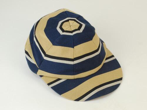 Hooped cricket cap. Attractive cream, white, black and blue hooped cricket cap, made by ‘Club Colours of Middlesex’. Size 71/4. Appears modern. Good/very good condition