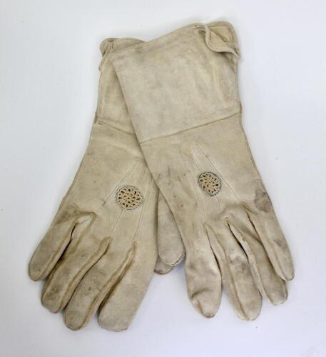 Wicket keeping gauntlets 1880’s. An early example of a pair of white kid leather wicket-keeping gloves used in the period, made by Geo. G. Bussey & Co of Peckham. The gloves offered little protection, some to the wrists and some ventilation. The gloves in