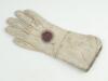 Wicket keeping gauntlet 1890’s. An early example of a single white kid leather wicket-keeping glove used in the period, made by Geo. G. Bussey & Co of Peckham. The right hand glove offered more protection to the wrists and improved ventilation. Some stain