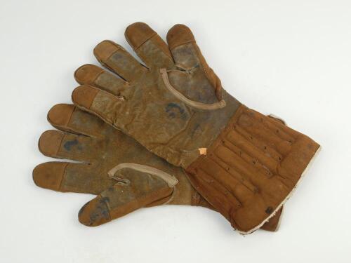 Wicket keeping gauntlets 1910’s. An early example of a of a pair of brown leather wicket-keeping gloves used in the period, makers unknown. These gloves were marketed before and just after World War One. Made, mainly of leather, they have padded finger an