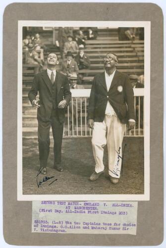 England v All India 1936. Original sepia press photograph of the two captains, Gubby Allen and Maharaj Vizianagram, tossing for innings at the start of the drawn second Test match at Old Trafford, 25th- 28th July 1936. The photograph nicely signed in ink 