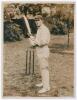 Charles George McCartney, New South Wales & Australia 1905-1927. Excellent sepia press photograph of McCartney, wearing Australian cap, in batting pose at the wicket with bat raised. The photograph by Hawkins of Brighton. Published by L.N.A. of Fleet Stre