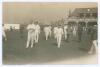 Australia tour of England 1921. Excellent and rare Walkers of Scarborough mono photograph of the Australian team being led onto the field by Captain Warwick Armstrong, the pavilion to background with spectators still wandering around the field. Imprint Wa